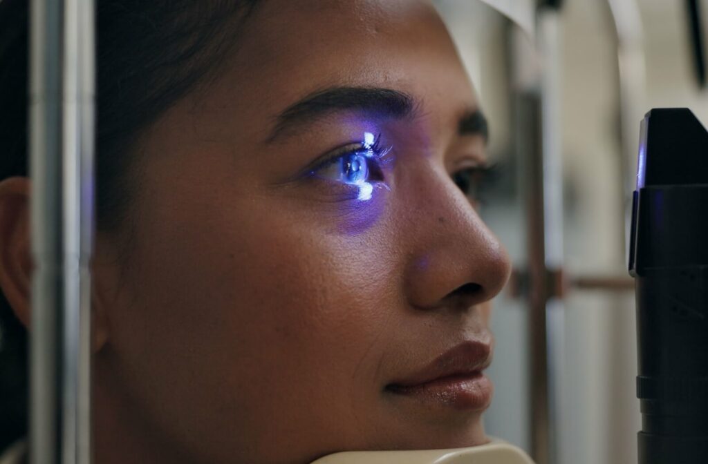 A young woman undergoes an eye exam.