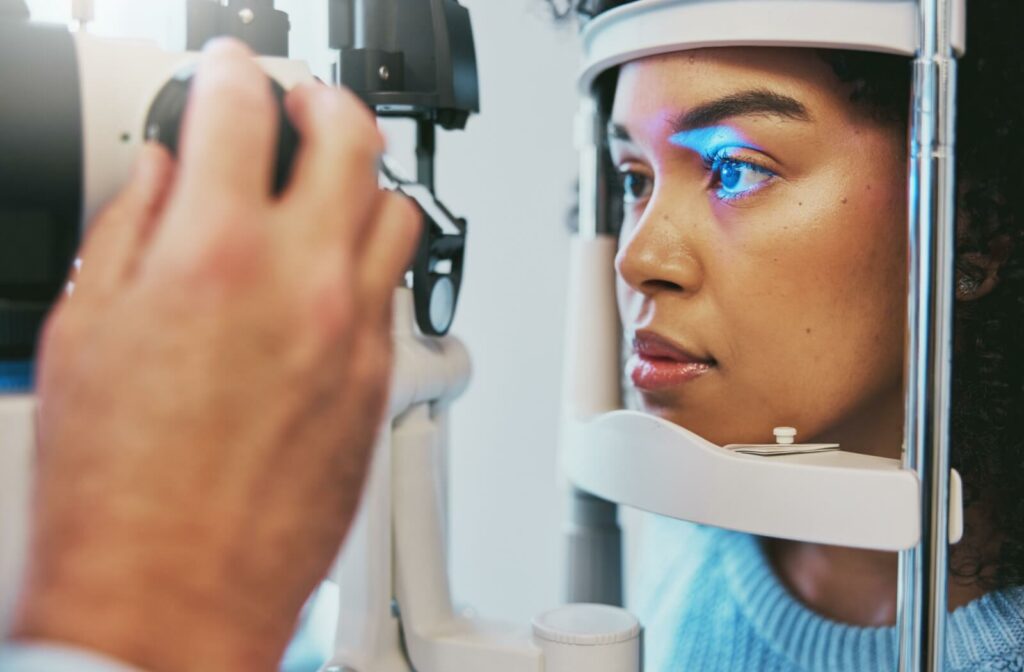 A young woman undergoes an eye exam.
