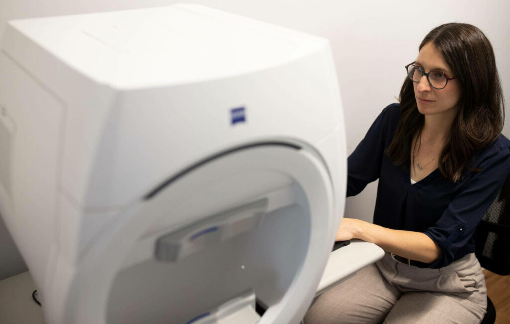 At Eye Q optometry, the doctor examining a patient's eye condition